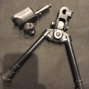 Metal bipod stand with adjustable legs and mounting parts.